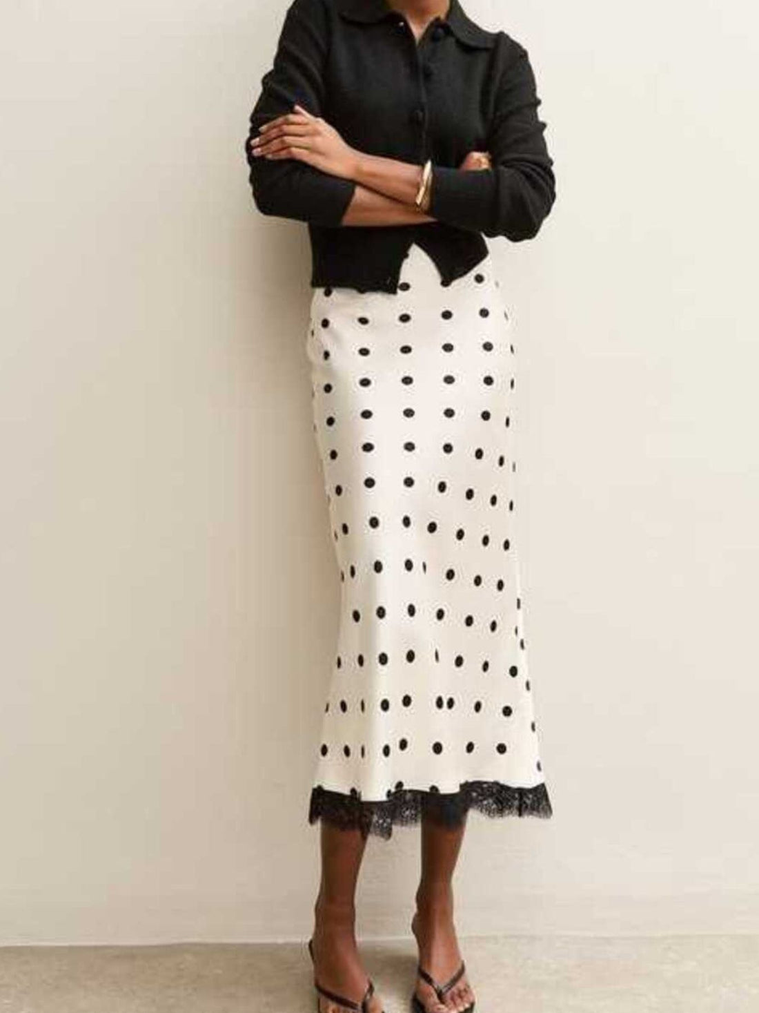 black midi skirt featuring lace and polka dot