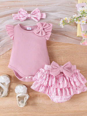 Pink cotton baby bodysuit with ruffled sleeves and bowknot, paired with a bowknot print ruffle skort.