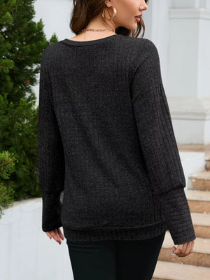 Textured V-neck knit long-sleeve top in gray with ribbed cuffs and hem.