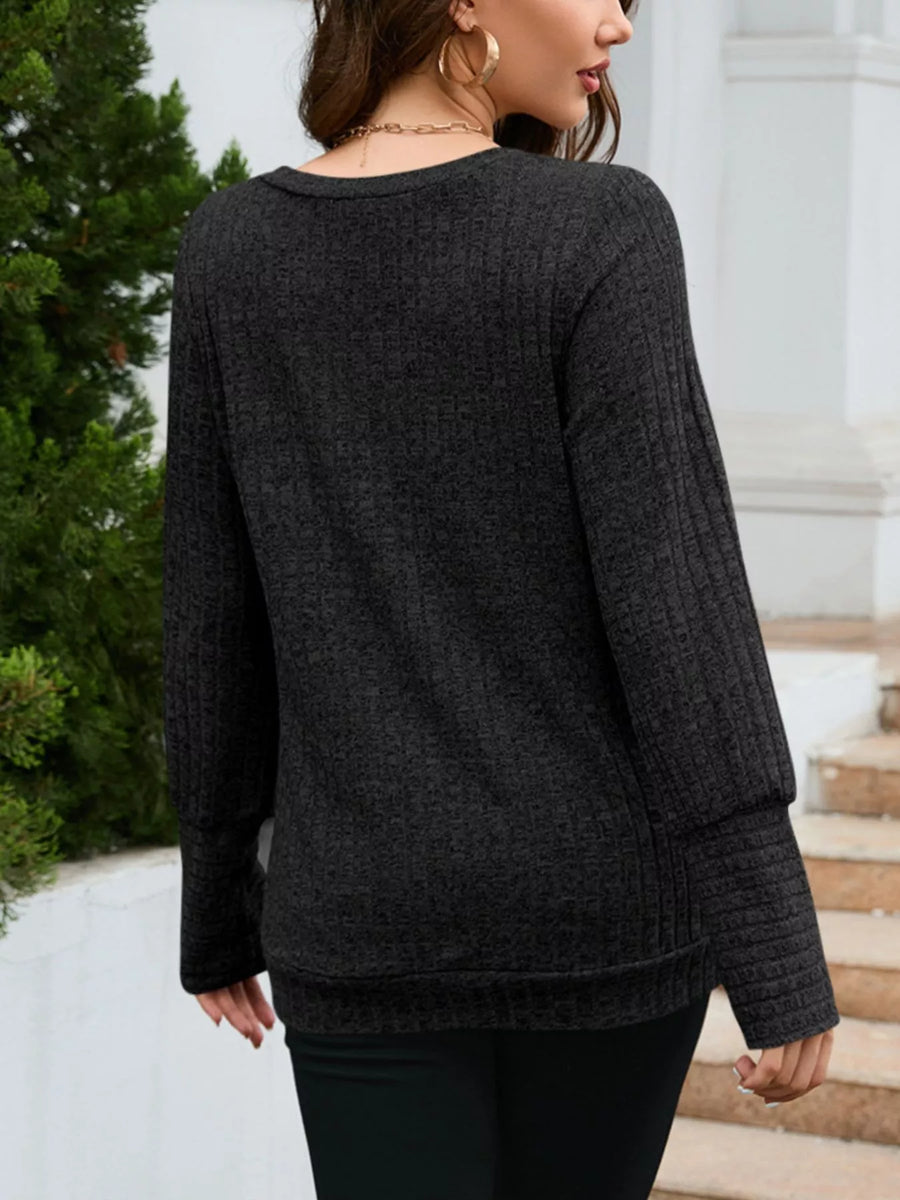 Textured V-neck knit long-sleeve top in gray with ribbed cuffs and hem.