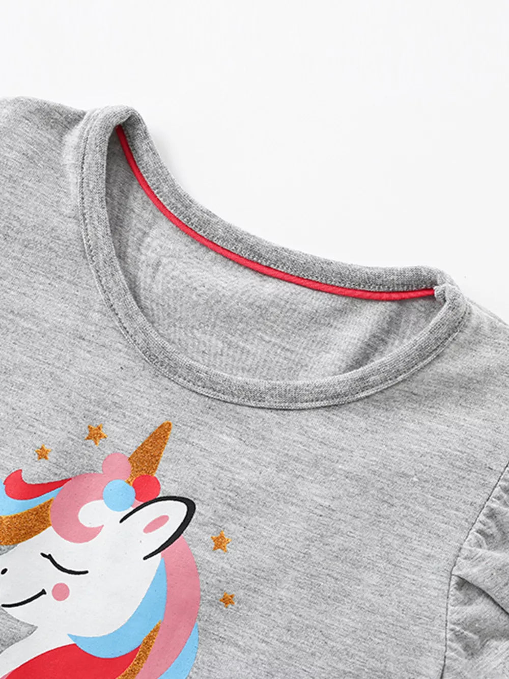 Grey cotton baby dress with unicorn graphic and red trim neckline.