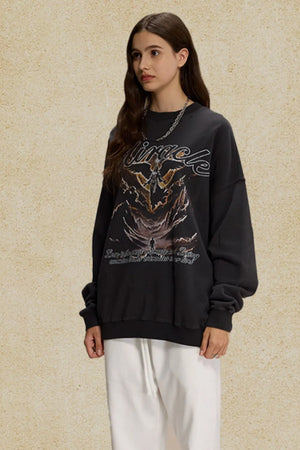 Black oversized sweatshirt with graphic print and text detail