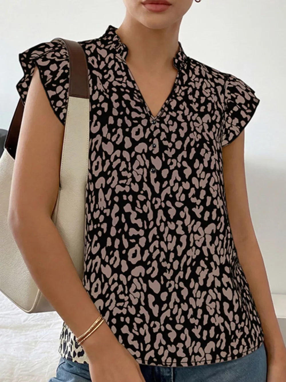 Black and tan leopard print ruffle sleeve v-neck blouse with a stand collar
