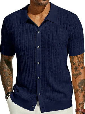 Navy textured knit polo shirt with openwork detail and button front.