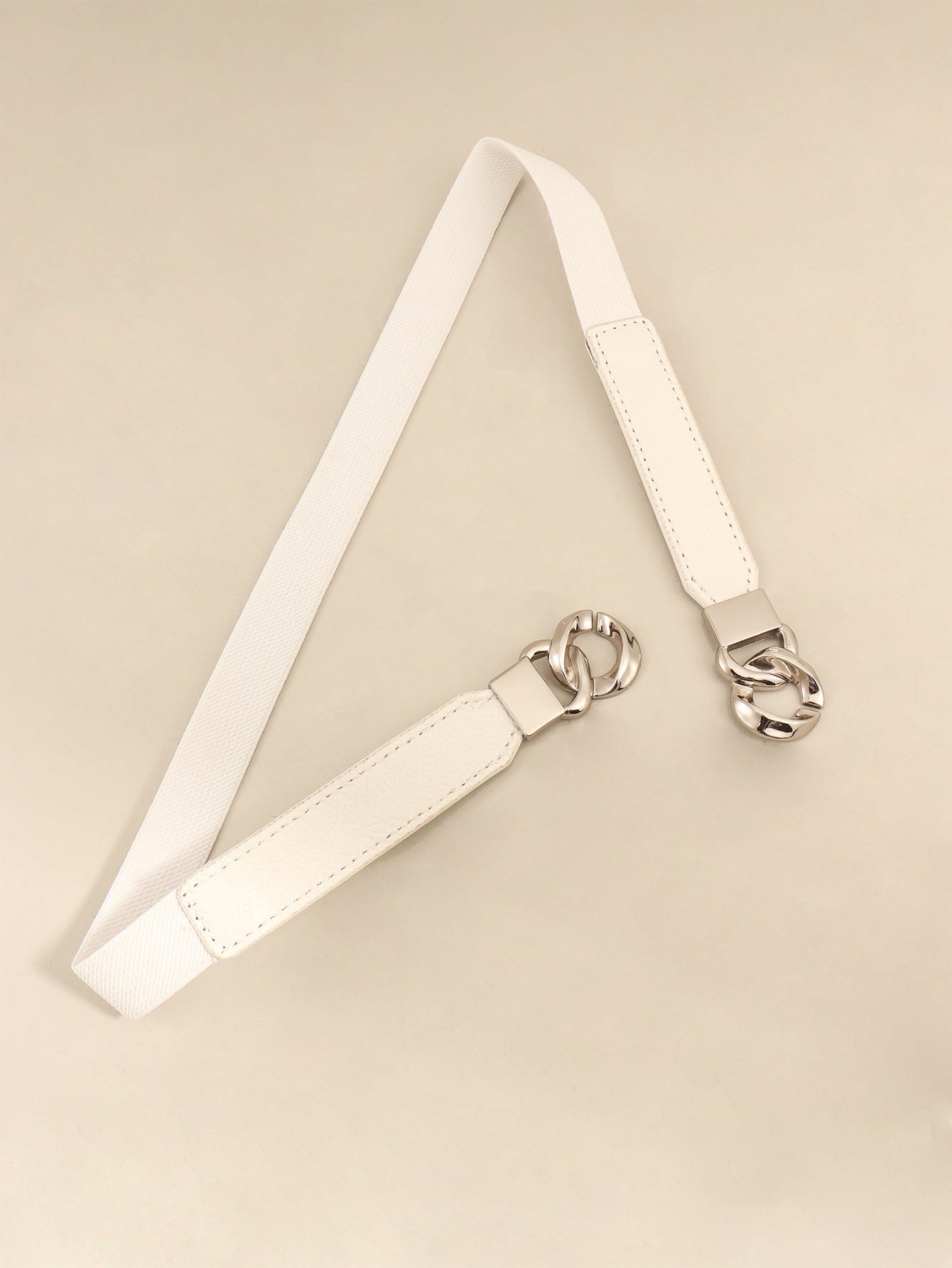 White elastic belt with faux leather ends and silver chain detail
