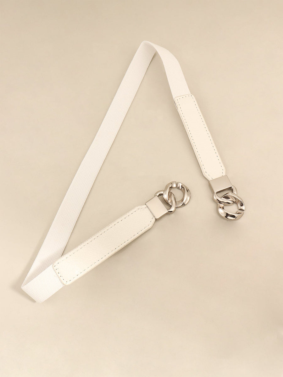 White elastic belt with faux leather ends and silver chain detail