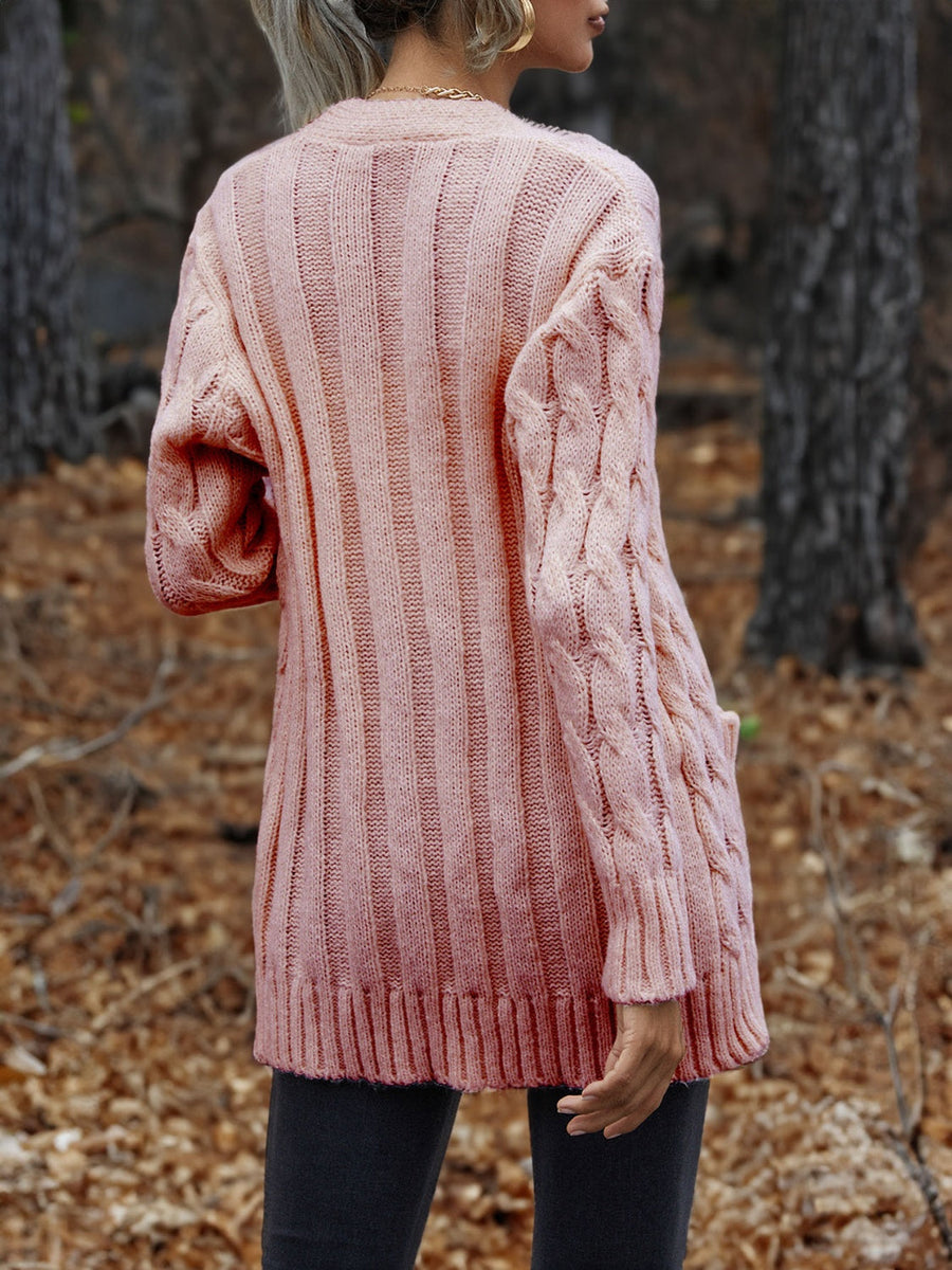 Carnation Pink cable knit cardigan with ribbed texture and cable sleeves.