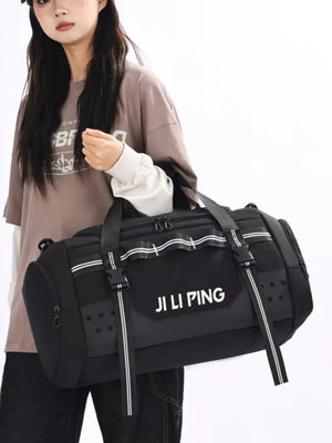Black Oxford cloth travel tote bag with white stripe details and buckle straps