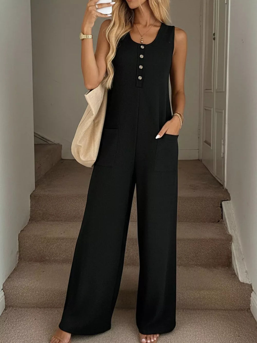 Black textured knit button-front sleeveless wide leg jumpsuit with pockets.