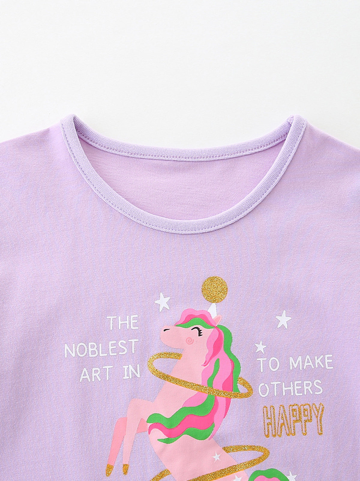 Lavender cotton toddler t-shirt with a pink unicorn graphic and text.