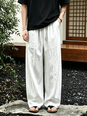 White wide-leg sweatpants with drawstring and front seams, men's casual pants.