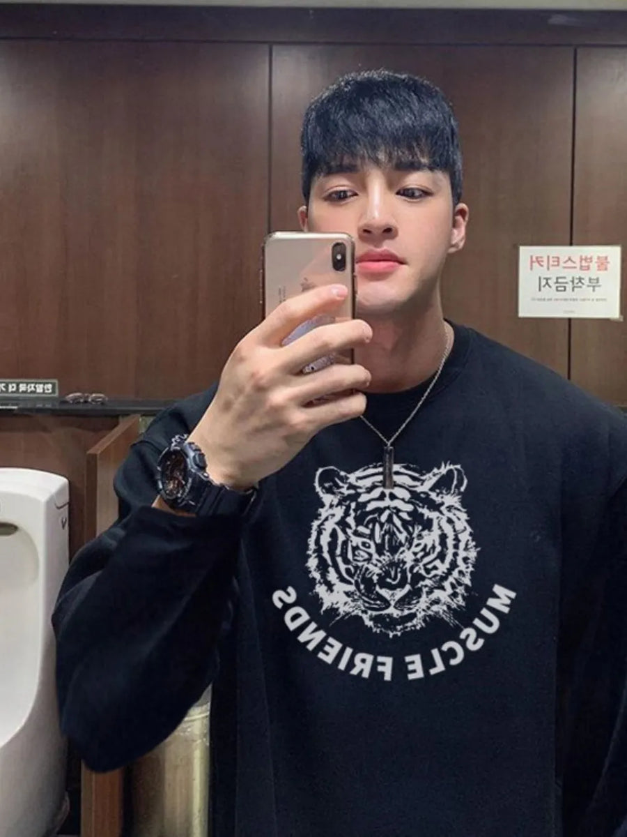 Black long sleeve tee with white tiger graphic and text
