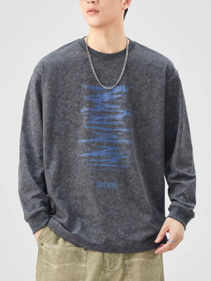 Dark Gray oversized long-sleeve tee with blue graphic text and the word DREAMS.