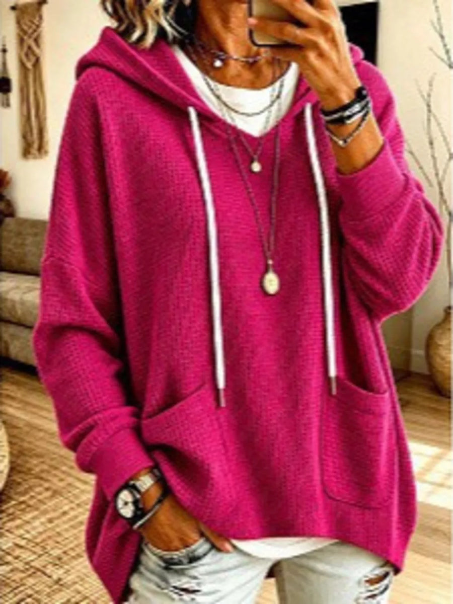 pullover hoodie in fuchsia featuring drawstring and relaxed fit
