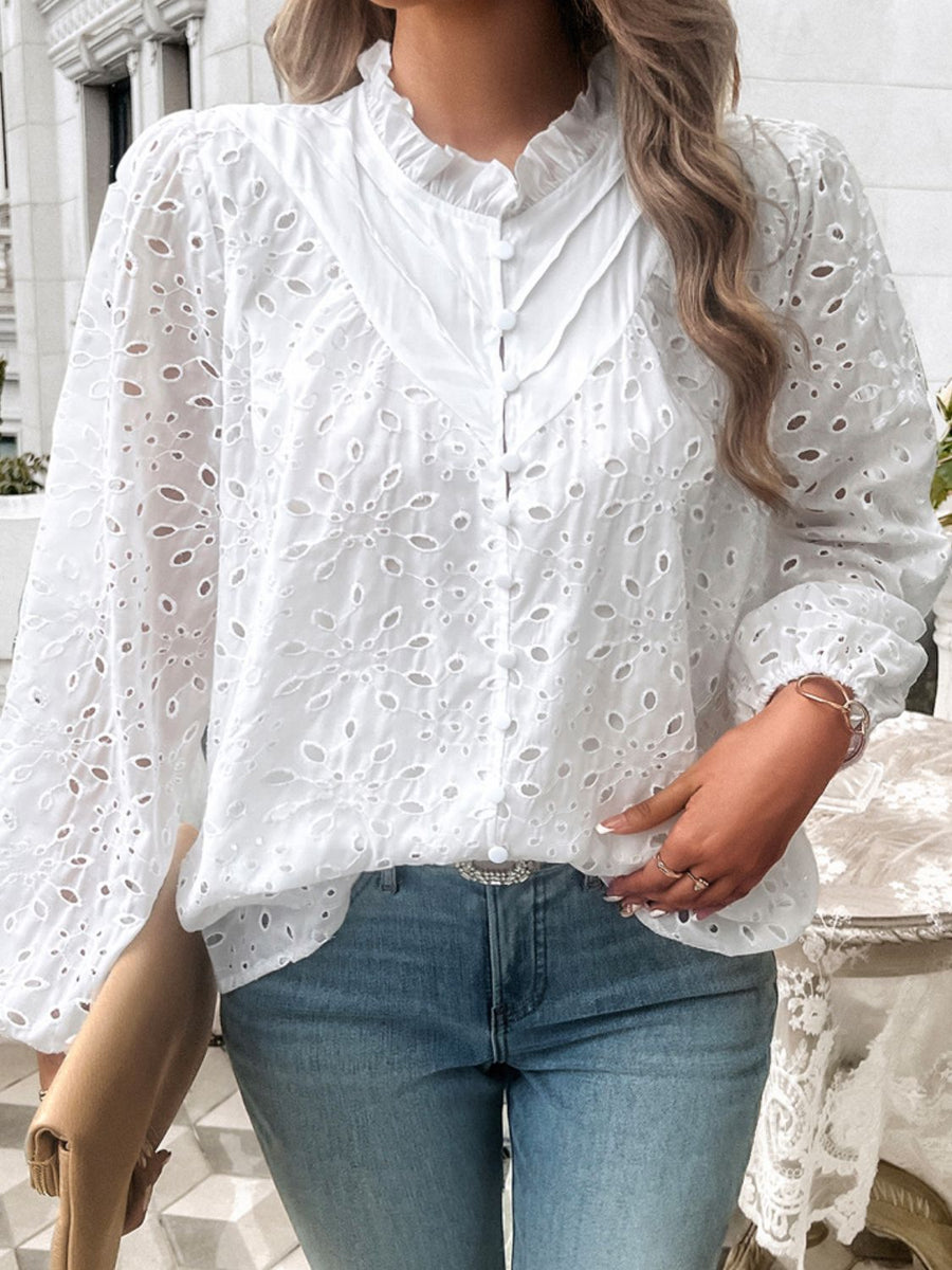 White eyelet embroidered blouse with ruffle collar and button front.