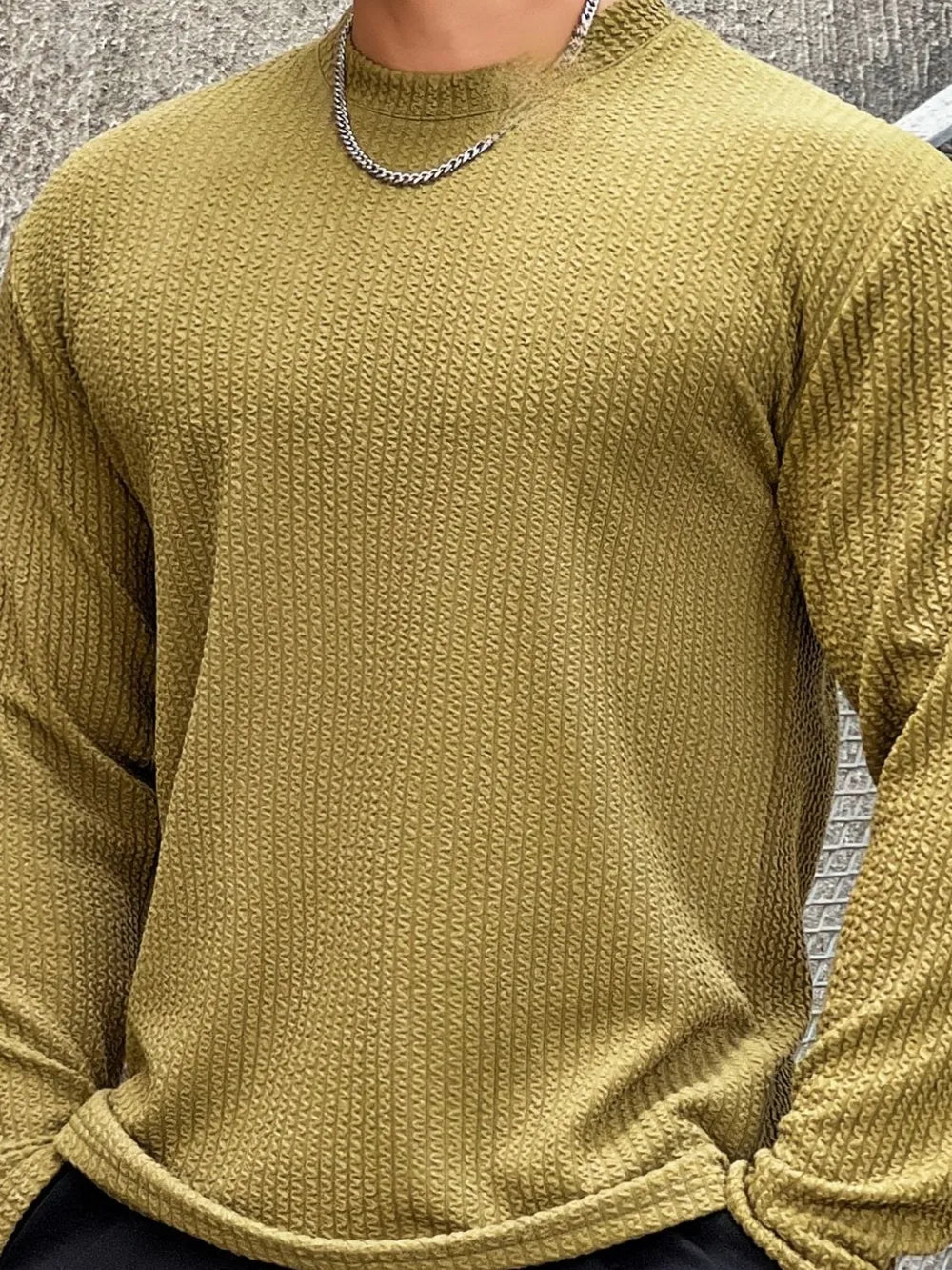 Men's yellow-green textured long sleeve tee with a round neck.