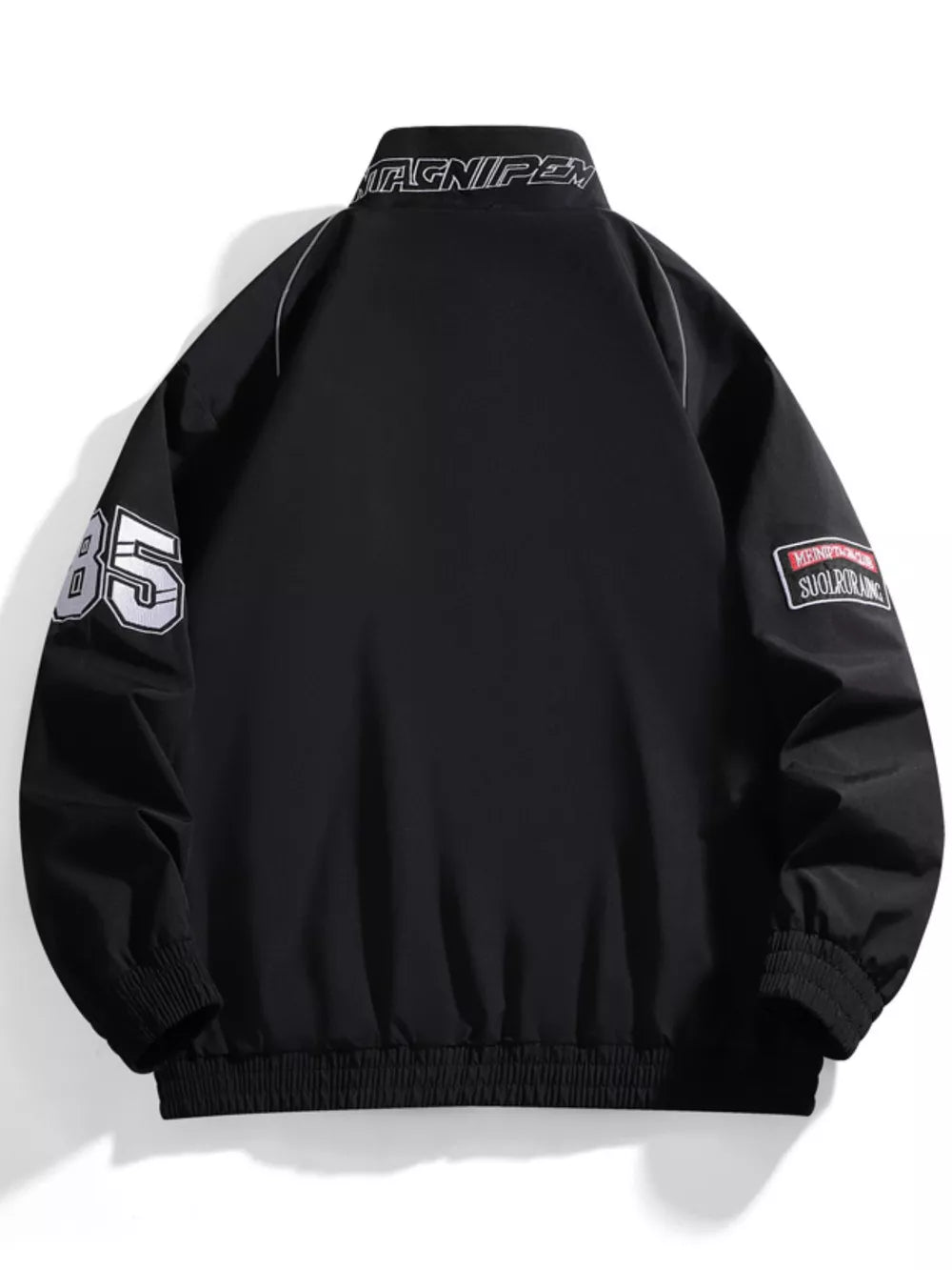 Black bomber jacket with racing-inspired details, "85" on sleeve, and embroidered patches.