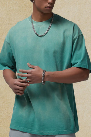 Oversized washed tee in Deep Teal with a relaxed fit and crew neck.