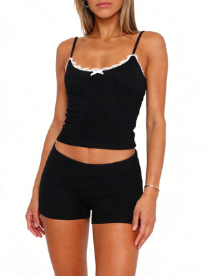 Black lace-trimmed cami and shorts set with a bow detail