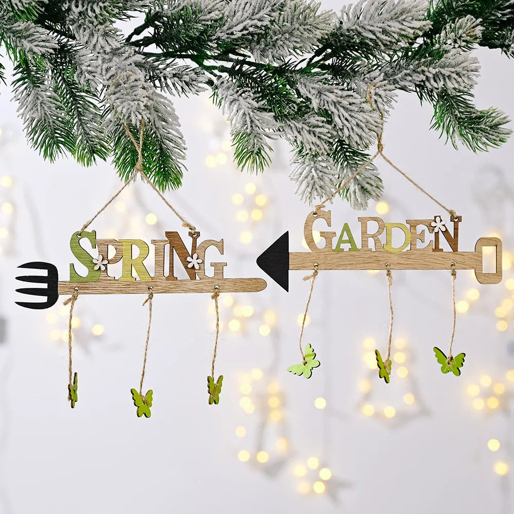 Spring Garden wooden sign with butterfly accents and fork detail.