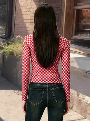 Red gingham tie-front long sleeve maternity shirt with a cropped fit.