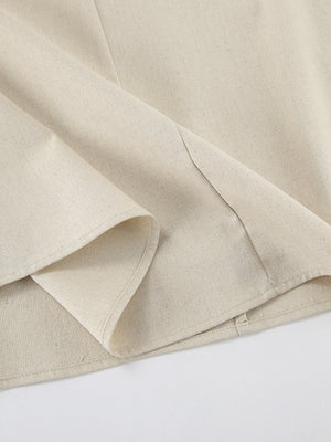 Beige smocked tube dress detail showing cotton fabric and a-line cut.