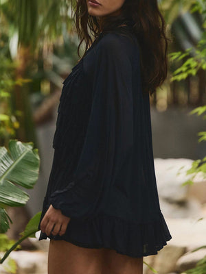 Black sheer ruffle trim beach cover-up with long sleeves and ruffled hem.
