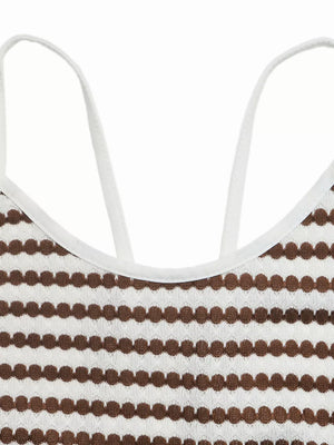 Halter neck midi dress with brown and white stripe pattern and textured detail.