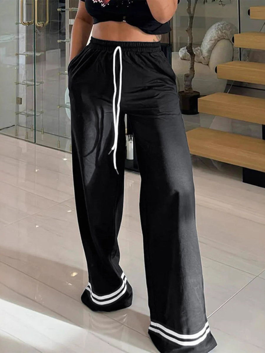 wide-leg pants in black featuring drawstring waist and wide-leg fit