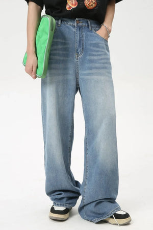 Oversized baggy denim jeans in medium wash, featuring a relaxed fit and casual styling.