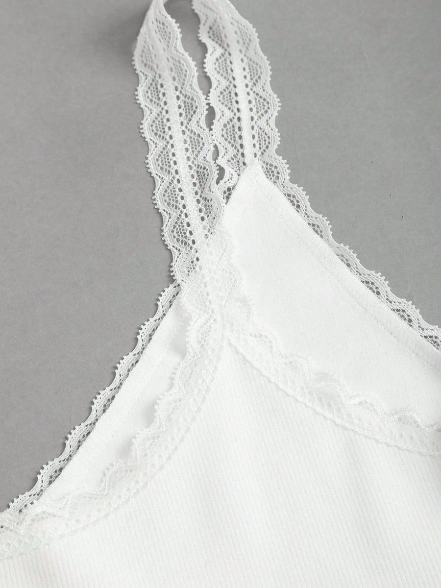 White lace cami with delicate lace trim on straps and neckline