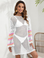 White crochet cover up dress with bell sleeves and striped cuffs, worn over a bikini