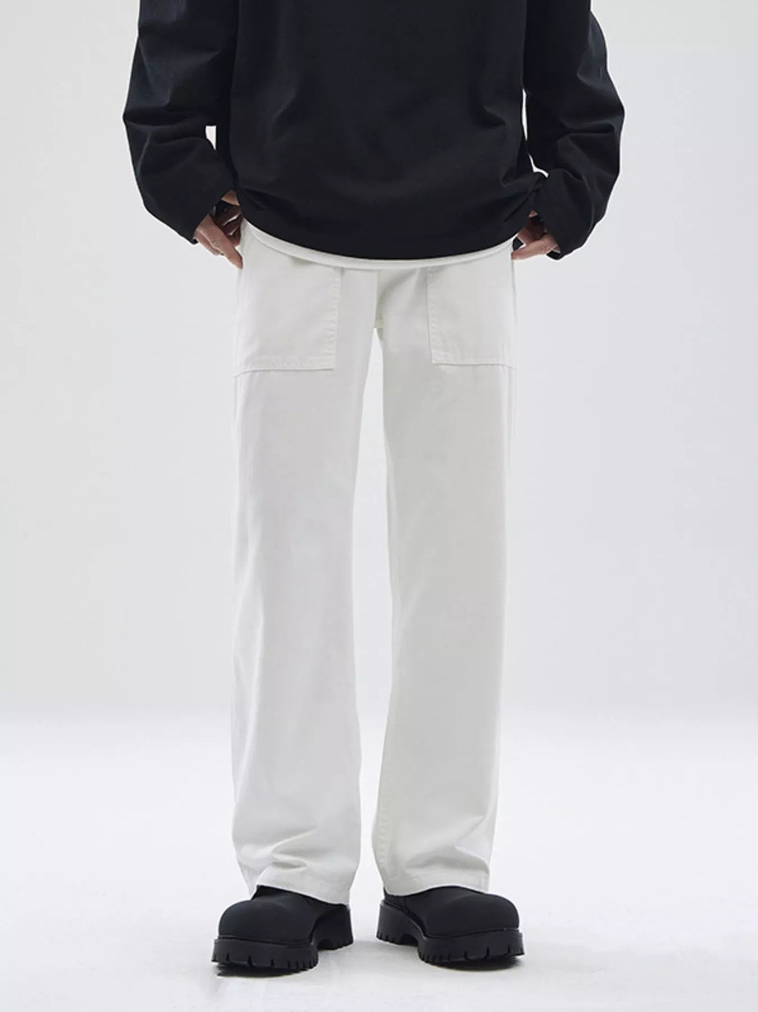 Relaxed fit white cotton chinos with patch pockets for men.