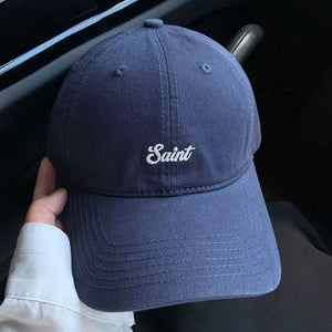 Navy blue cotton baseball cap with white script embroidery