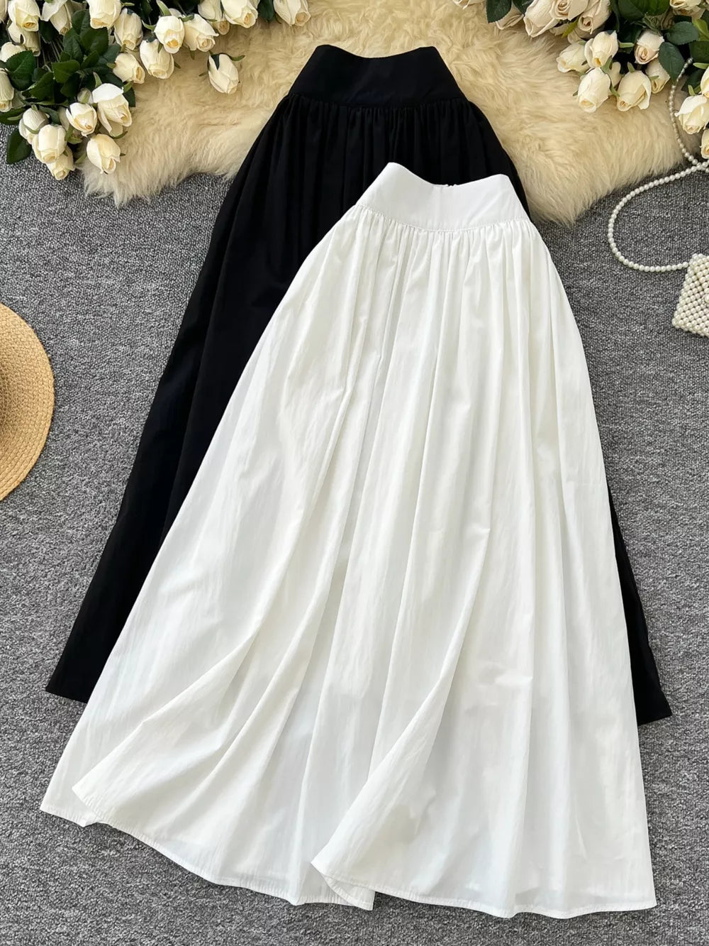 Gathered waist high-waisted a-line skirts in black and white with pockets.