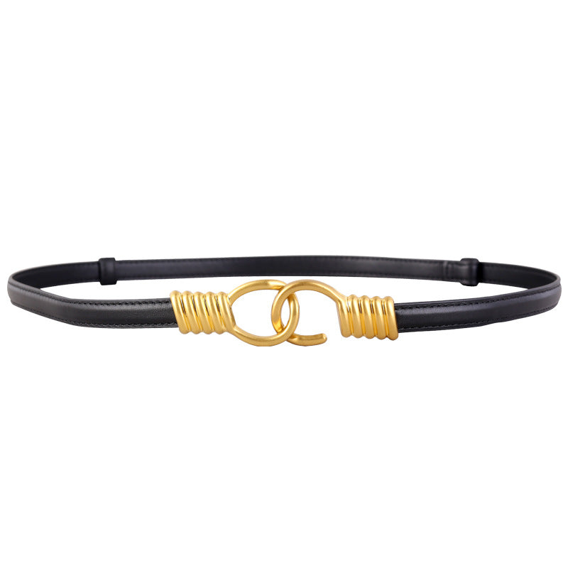 Black cowhide leather skinny belt with gold interlocking ring buckle and coiled detail
