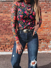 orange top featuring sheer and floral