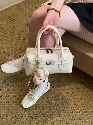 Ivory handbag with zip-front and geometric