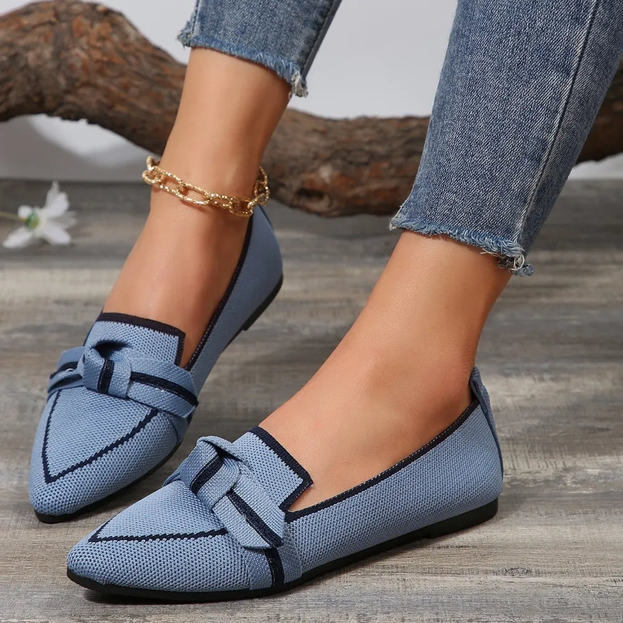 Dusty blue knit bow loafers with contrast trim and pointed toe.