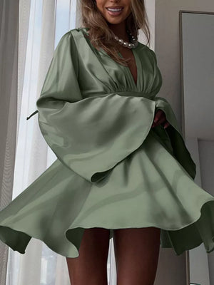 Sage green satin mini dress with deep V-neck, flared sleeves, and cinched waist.
