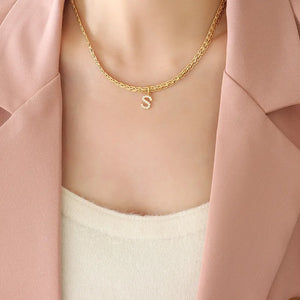 Gold textured chain necklace with a crystal initial S charm