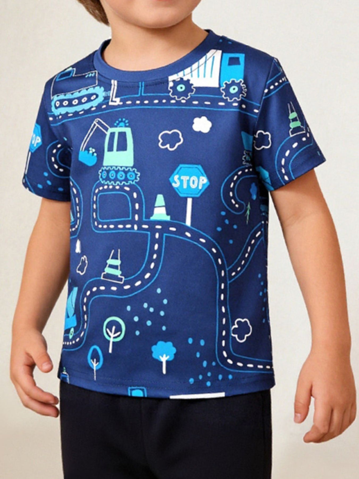 Toddler blue crew neck t-shirt with a road construction print featuring diggers, trucks, and stop signs.