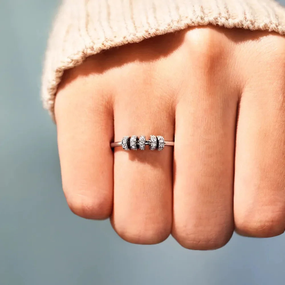 Sterling silver pavé band ring with rotating beads, silver tone