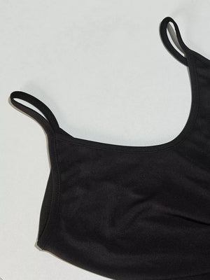 Black maxi dress with spaghetti straps and a scoop neckline.
