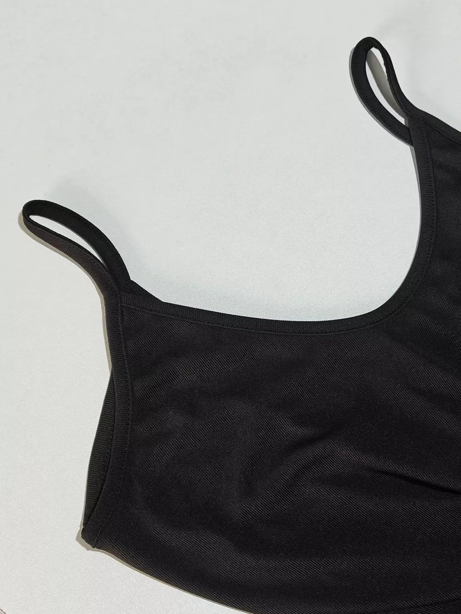 Black maxi dress with spaghetti straps and a scoop neckline.