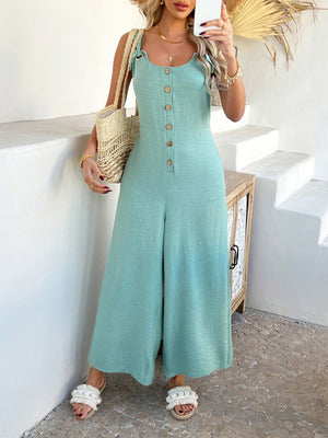 Gum Leaf linen wide-leg jumpsuit with button front and tie straps.