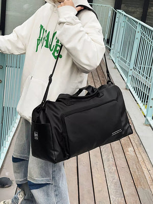 Black canvas travel bag with versatile straps and exterior pockets.
