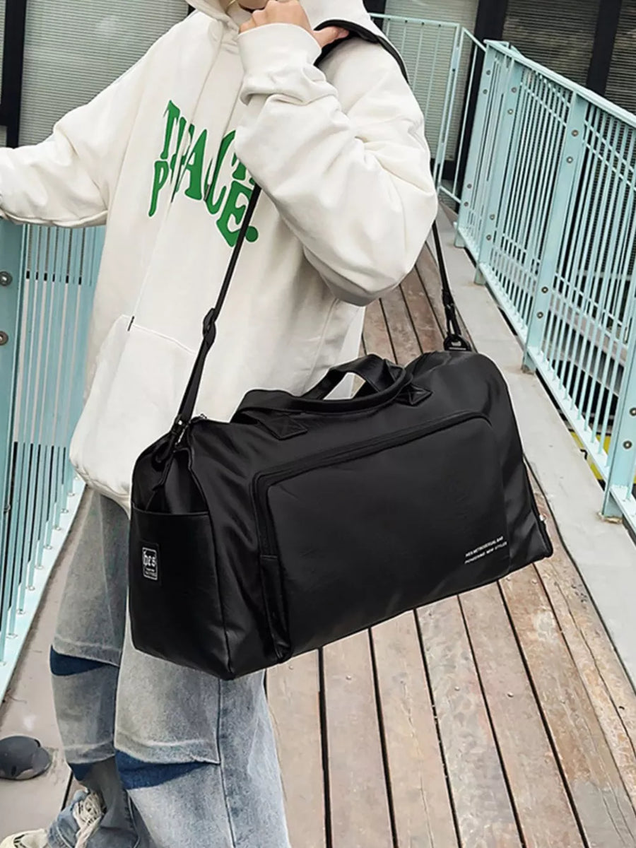 Black canvas travel bag with versatile straps and exterior pockets.