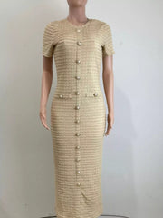 Textured midi dress in Khaki with short sleeves, gold buttons, and pocket details.