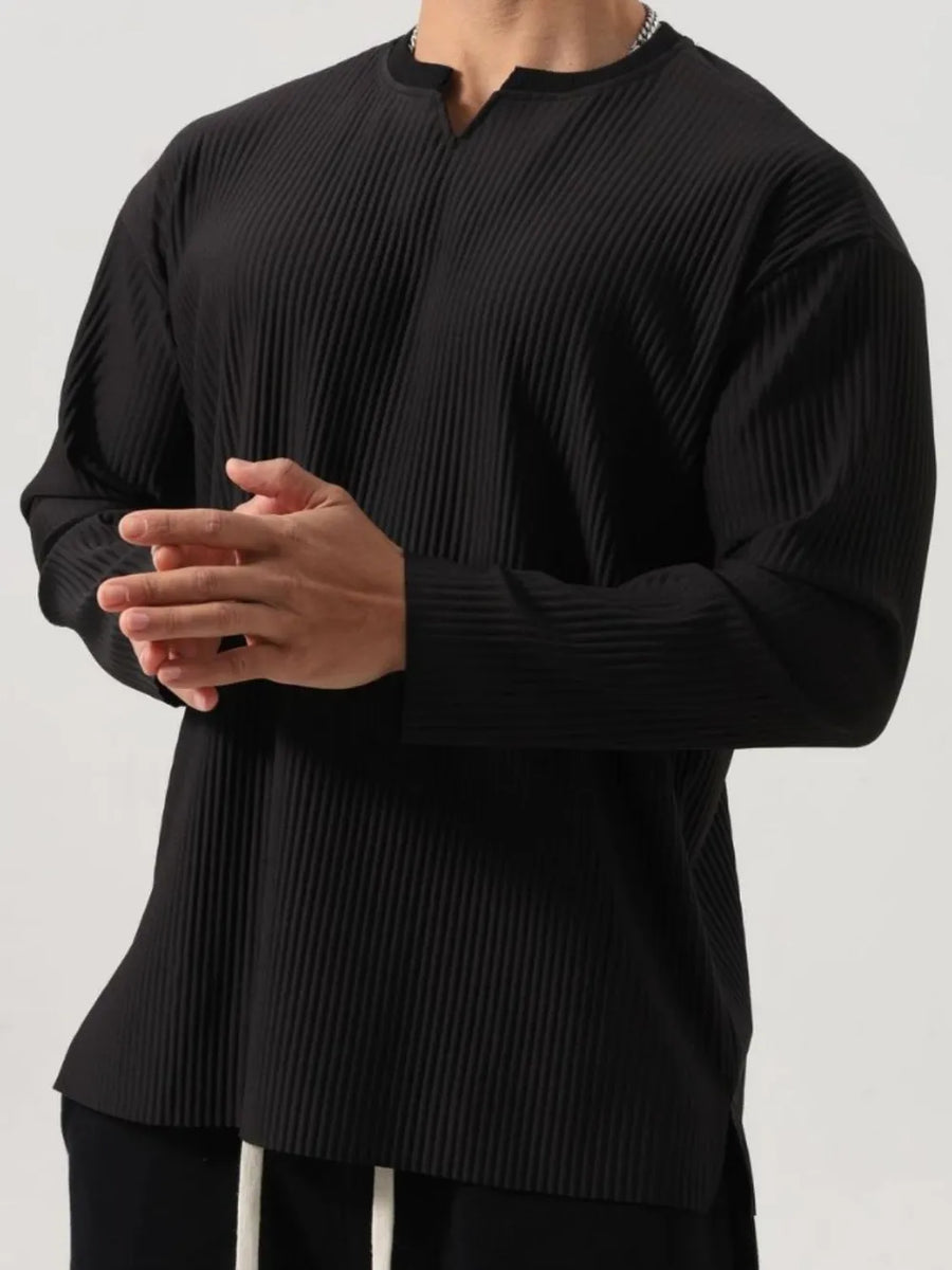 Black textured plissé henley long sleeve top with a notched neckline.